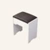 Fidel vanity stool with cushioned seat and white frame on a plain background.