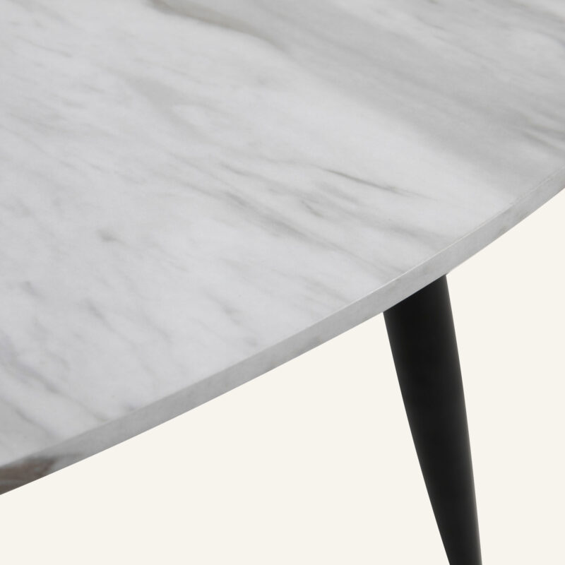 TAB-718 (2) Close-up of a minimalist marble effect round coffee table with black tapered leg.