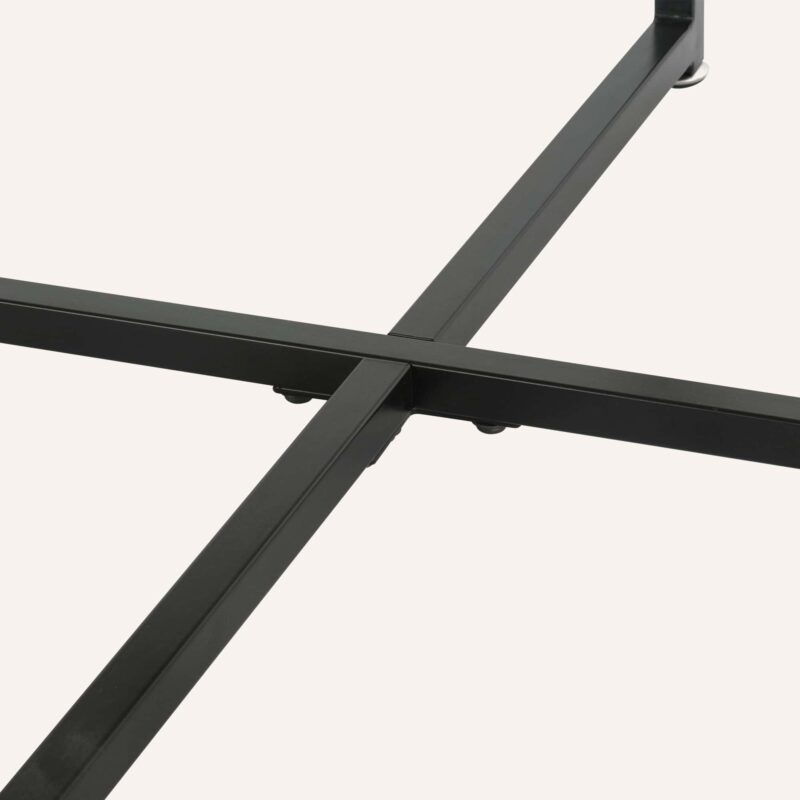 TAB-719 (15) Close-up of a black metal table frame with intersecting legs.