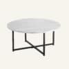 White marble effect round coffee table with black metal legs.