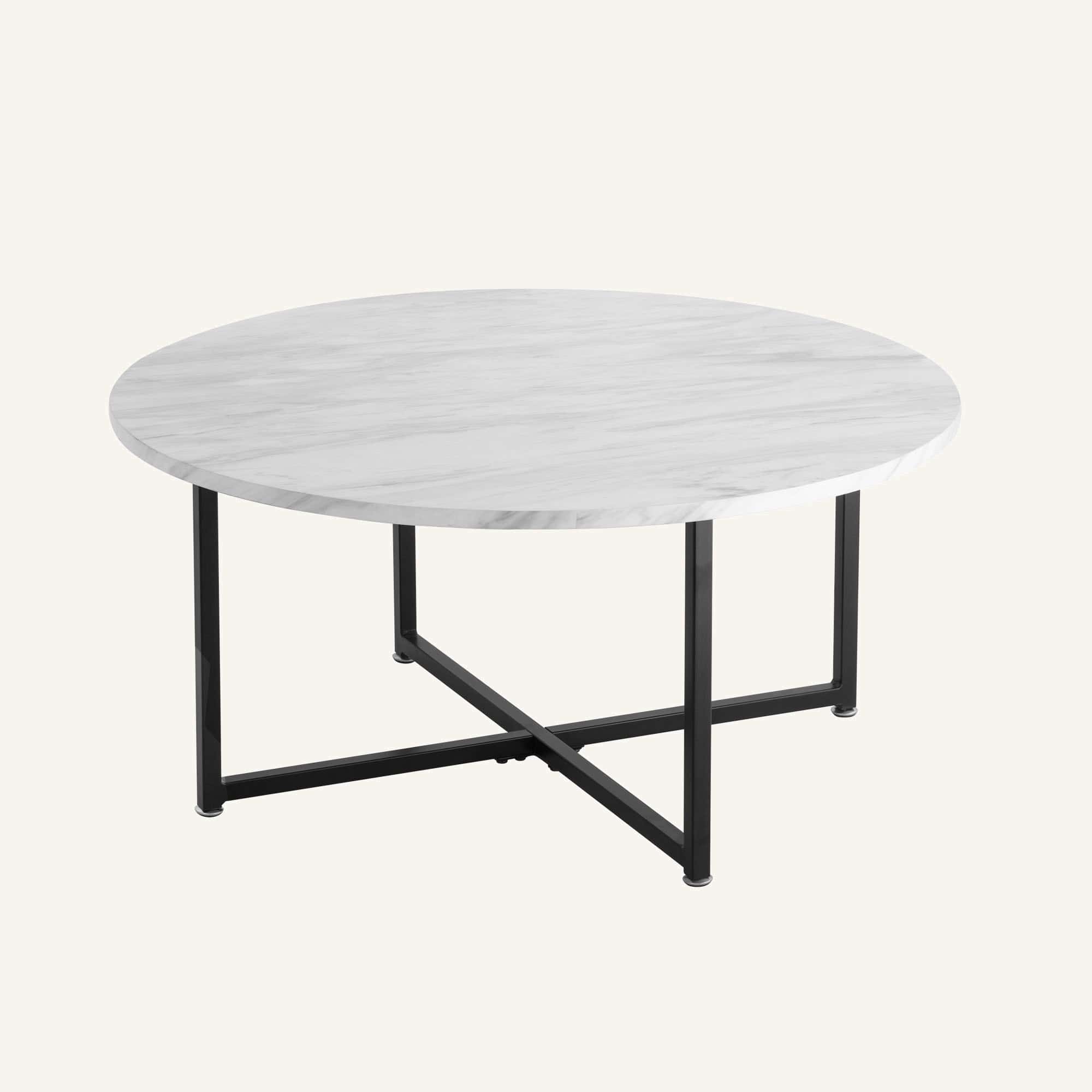 White marble effect round coffee table with black metal legs.